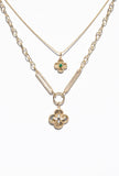 14K Clover Charms stacked on necklaces