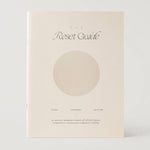 Book titled 'The Reset Guide' with a circular design on a white background