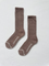 Pair of brown socks with white trim on a light gray background