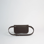 Brown leather belt bag on a light gray background