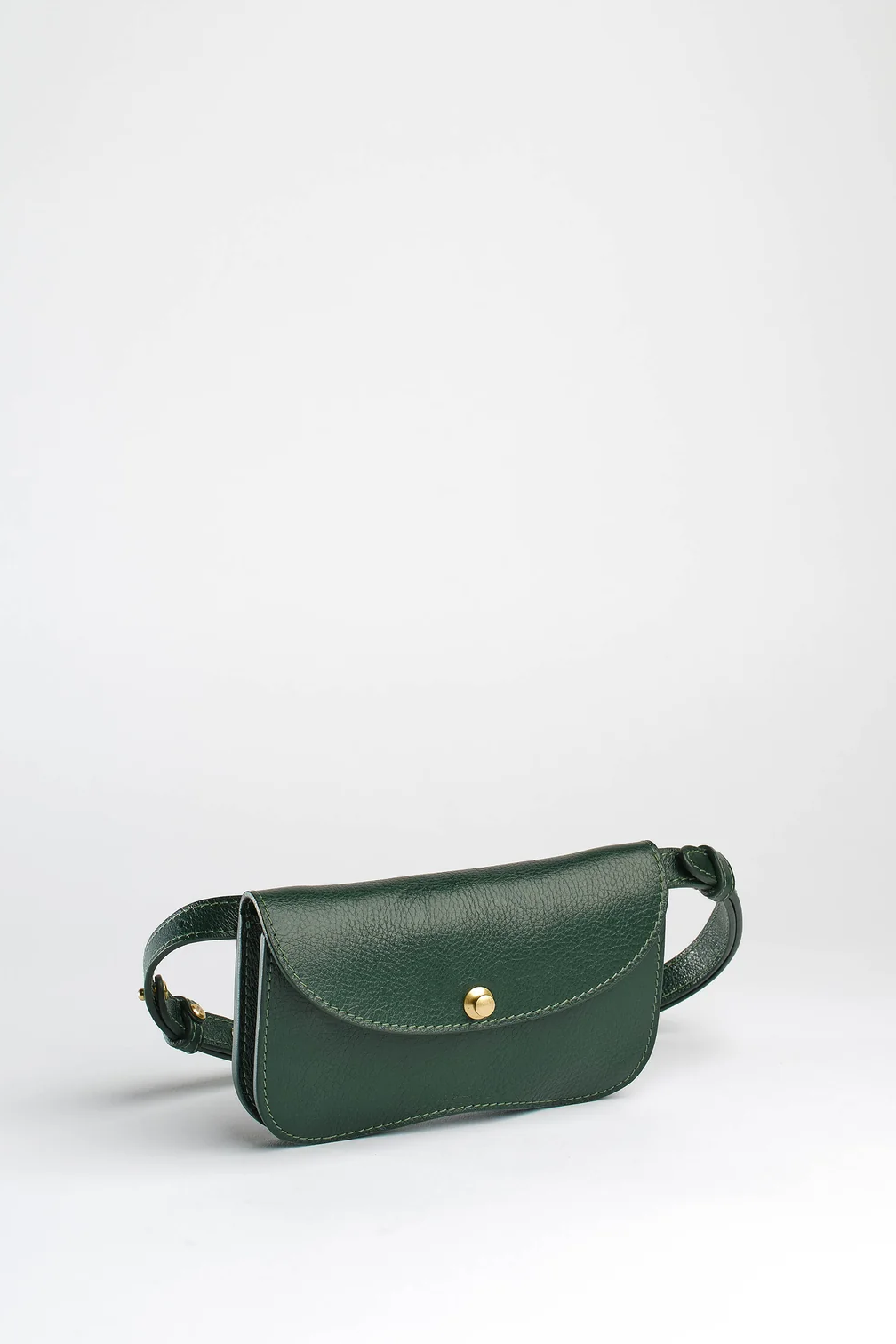Green leather waist bag on a white background
