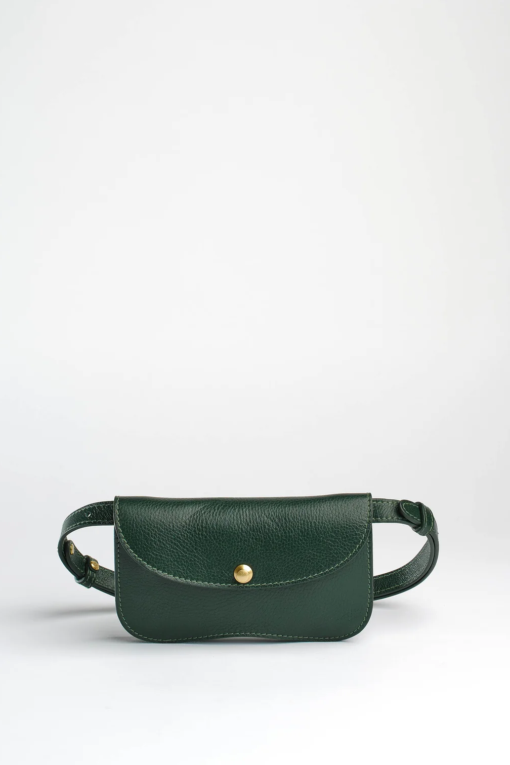 Green leather waist bag on a white background