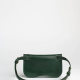 Green leather handbag on a white background