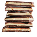 Stack of chocolate candy bars on a white background