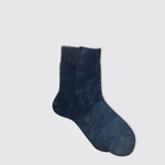 Blue sock on a light gray background