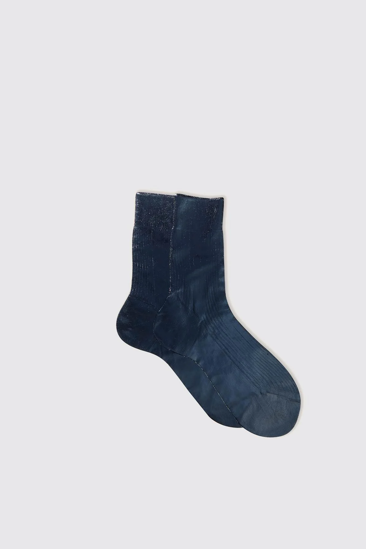 Blue sock on a light gray background