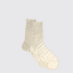 Pair of beige socks on a light gray background