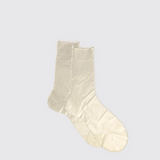 Pair of beige socks on a light gray background