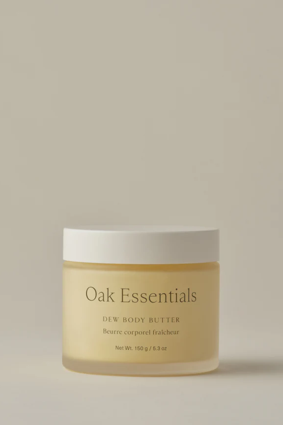 Jar of Oak Essentials Dew Body Butter on a beige background