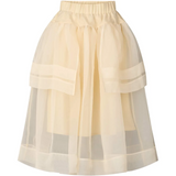Beige skirt with layered design on a white background