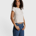 Model wearing JONES + CO Lisa Tee in natural stripe recycled cotton with a shrunken neckline and blue denim jeans.