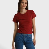 Model wearing a JONES + CO ruby red slim fit crew neck t-shirt made from recycled cotton with blue denim jeans