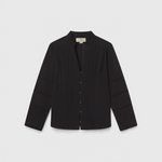 JONES + CO Maris black blouse featuring pintuck details, a ruffled stand collar, and long sleeves.