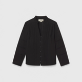 JONES + CO Maris black blouse featuring pintuck details, a ruffled stand collar, and long sleeves.
