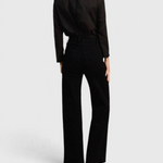 JONES + CO Maris black blouse with ruffled collar and long sleeves worn with matching trousers, back view
