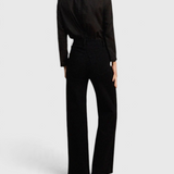 JONES + CO Maris black blouse with ruffled collar and long sleeves worn with matching trousers, back view