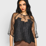 MIRTH Bari Organza Top in Black Waterlily — worn, close detail of the waterlily embroidery