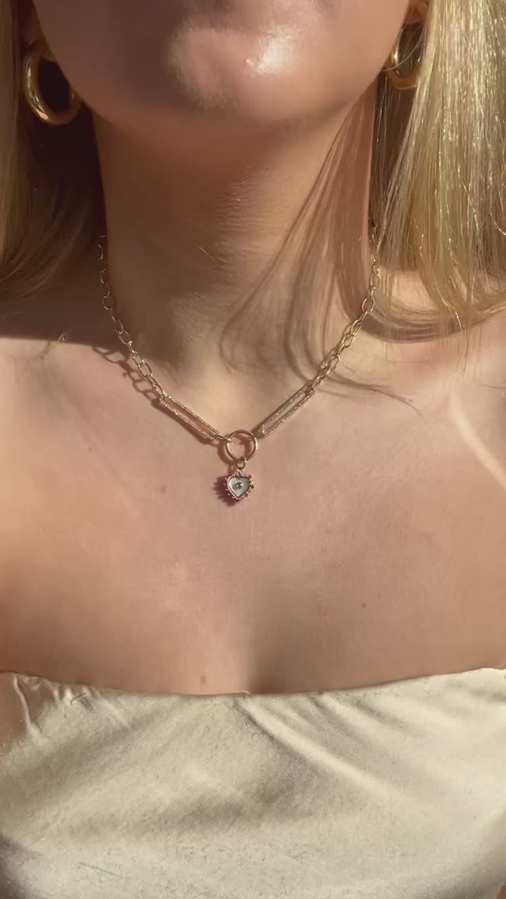 video of 14K Abalone Heart Charm on the body