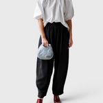 JONES + CO Lanson white cotton crewneck top with short bubble sleeves and neck ruching worn with black trousers