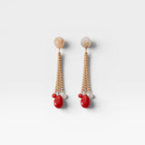 JONES + CO Bootes Earrings: Cream multi-colored spherical stud drop earrings with gold chains and red acrylic charms.