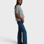 Model wearing JONES + CO Rebecca French terry sweatshirt in griffin grey with three-quarter puff sleeves and jeans