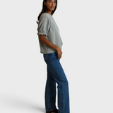 Model wearing JONES + CO Rebecca French terry sweatshirt in griffin grey with three-quarter puff sleeves and jeans