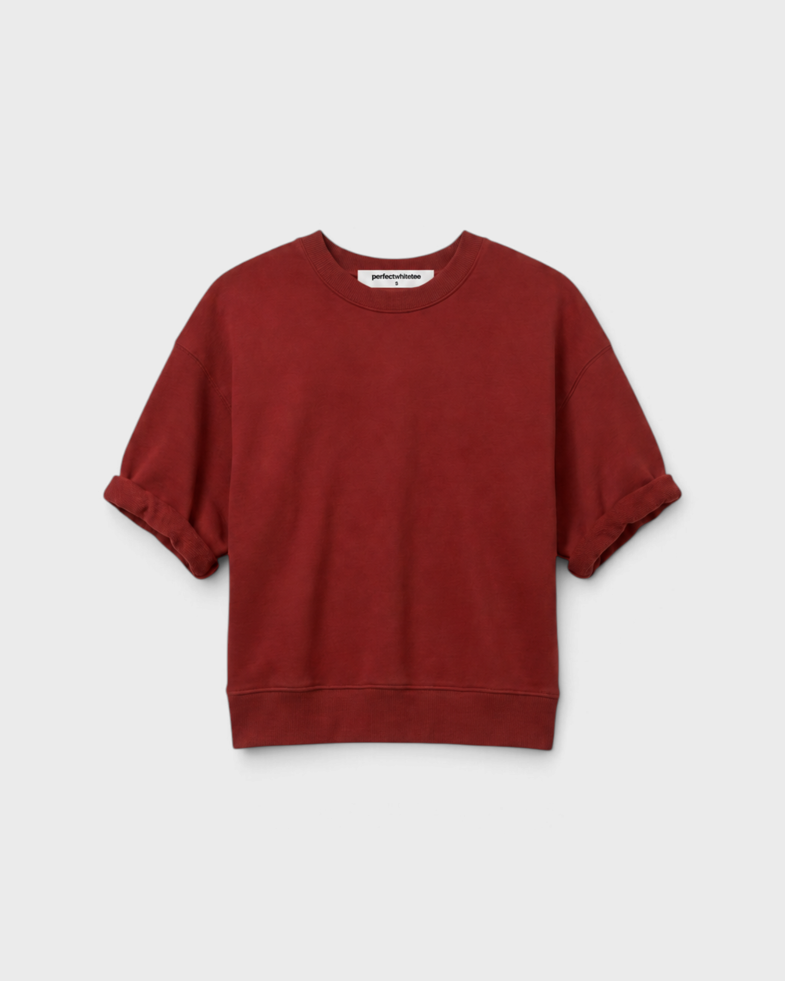 JONES + CO Rebecca French terry sweatshirt in ruby red with three-quarter puff sleeves and a crew neckline.