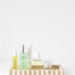512 Tray - Travertine styled with beauty products on it 
