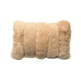 Beige fur pillow on a white background