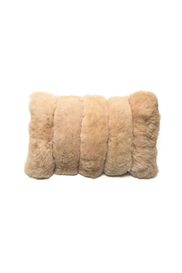 Beige fur pillow on a white background