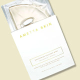 Ametta Skin face mask packaging on a beige background