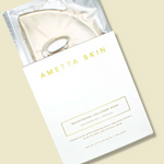 Ametta Skin face mask packaging on a beige background