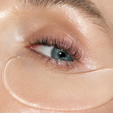 Close-up of a person's eye with a clear gel patch under the eye.