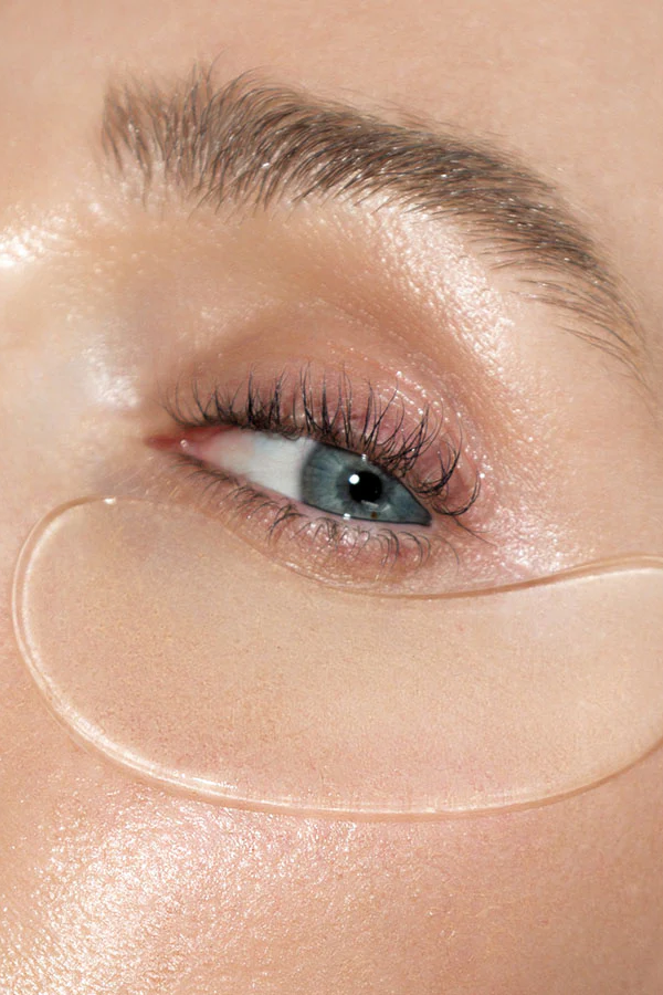 Close-up of a person's eye with a clear gel patch under the eye.