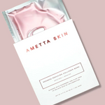 Ametta Skin pink collagen mask in packaging on a light pink background