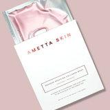 Ametta Skin pink collagen mask in packaging on a light pink background