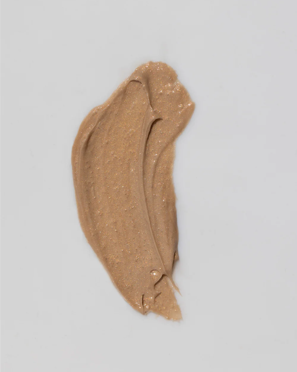 Swatch of brown mask on a light gray background