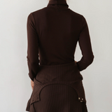 image of back of brown turtleneck on model