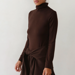 image of side view of brown turtleneck on model 
