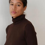close up of brown turtleneck on model