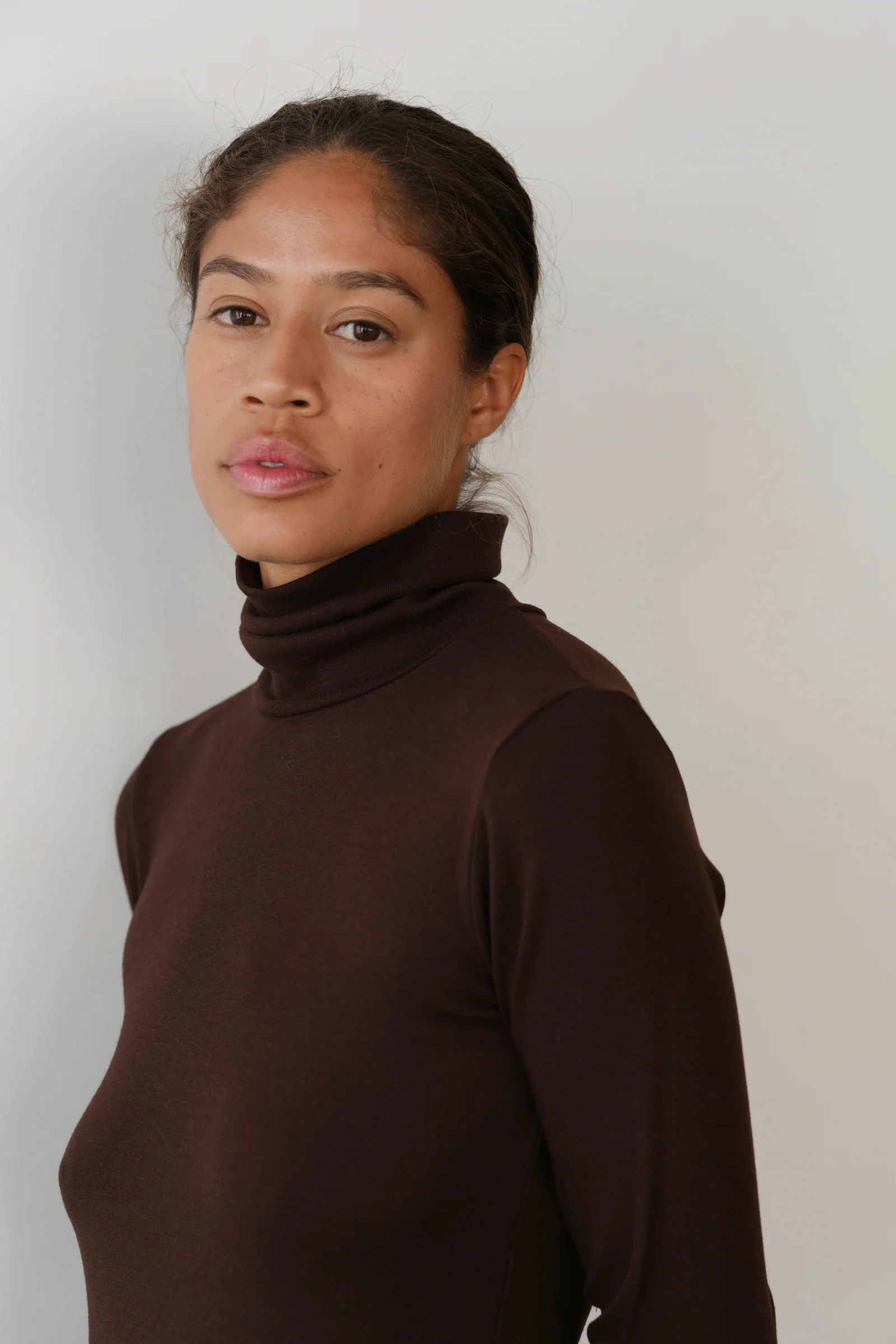 close up of brown turtleneck on model