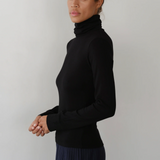 image of side view of model wearing black turtleneck