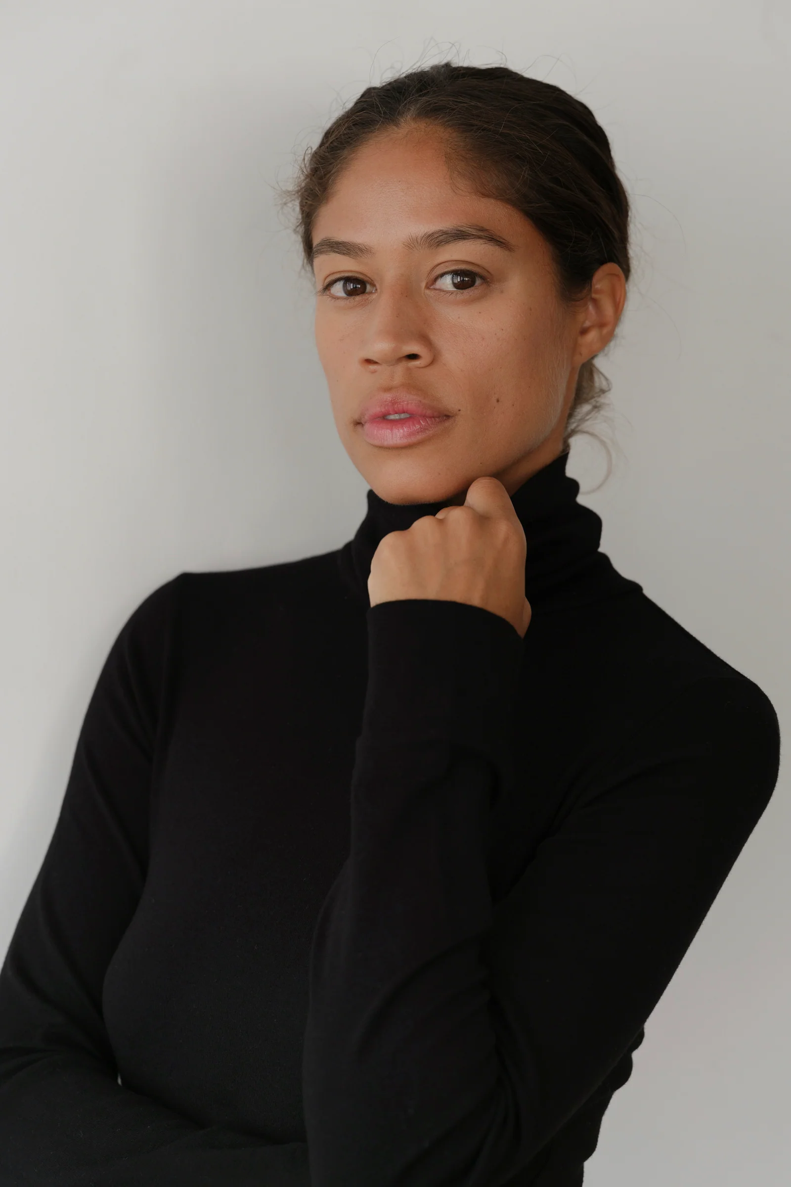 close up of model in black turtleneck