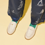 Elba Penny Loafer - Vanilla Woven Calf with Hardware on model, close up view of feet