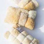 Three colorblock pillows lying on a light background. 