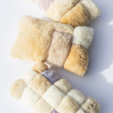 Three colorblock pillows lying on a light background. 