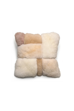 Fur pillow with a woven pattern in beige and brown tones on a white background