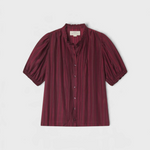 JONES + CO Mira blouse in garnet shadow-stripe with ruffled stand collar, pintucked bib, and short puffed sleeves.