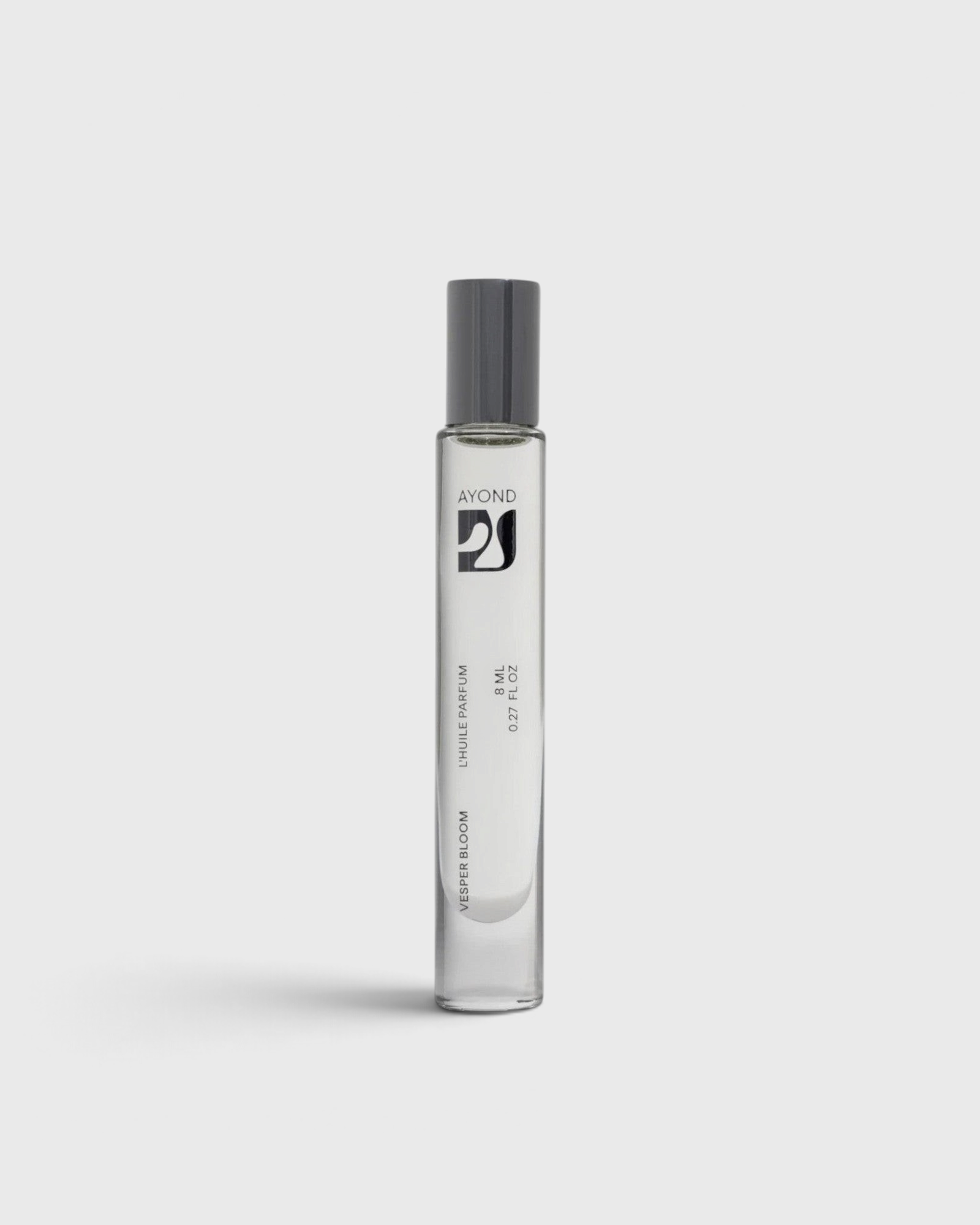 JONES + CO natural perfume oil roll-on in a sleek glass bottle with a grey cap for easy fragrance application