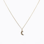 Image of small charm on chain of 14K Dainty Moon Charms